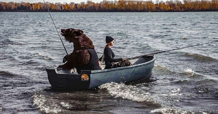 Rescued Brown Bear Goes Fishing With Owner 